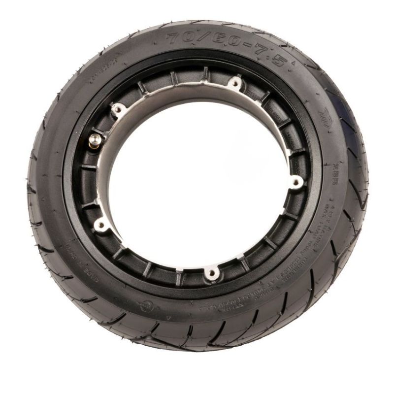 Black tire with a circular metal hub insert showing bolt holes, set against a white background.