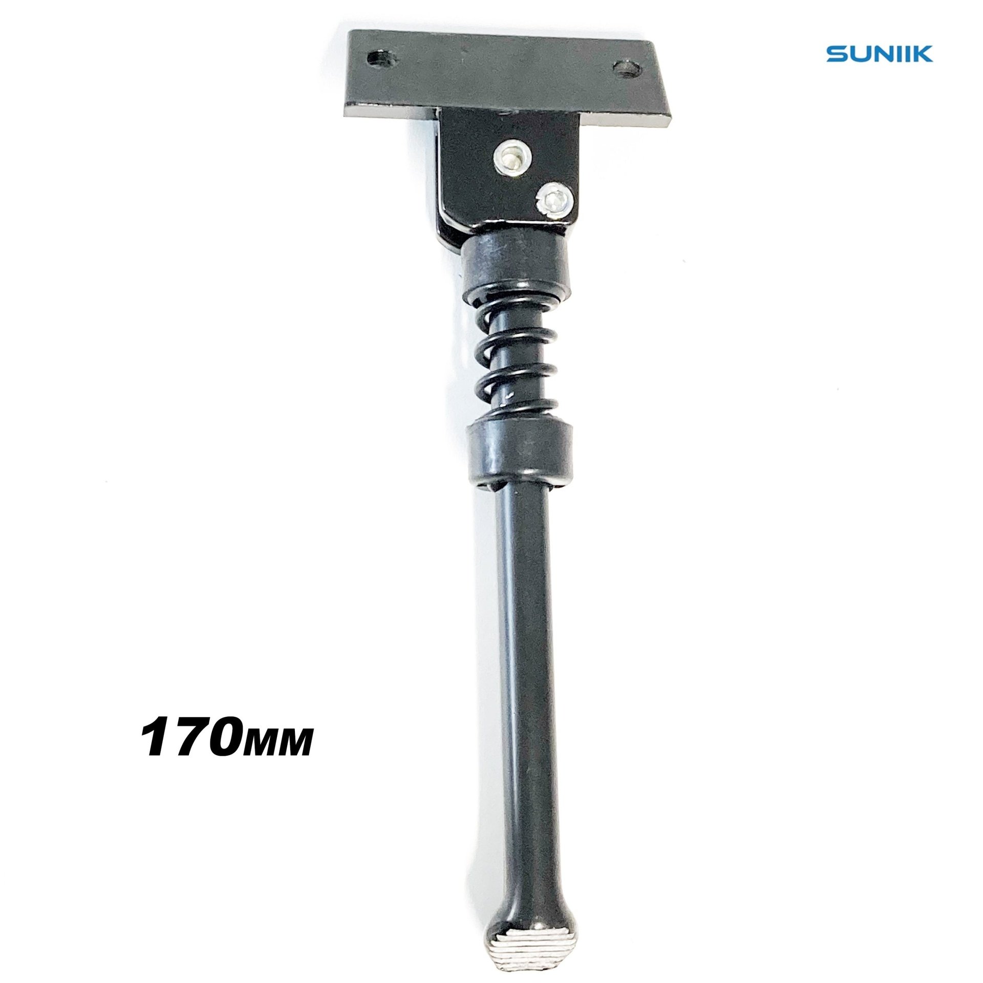 Top of a telescoping tool with a rectangular metal head, hinge, and coil-spring shaft; Sunik logo in corner.
