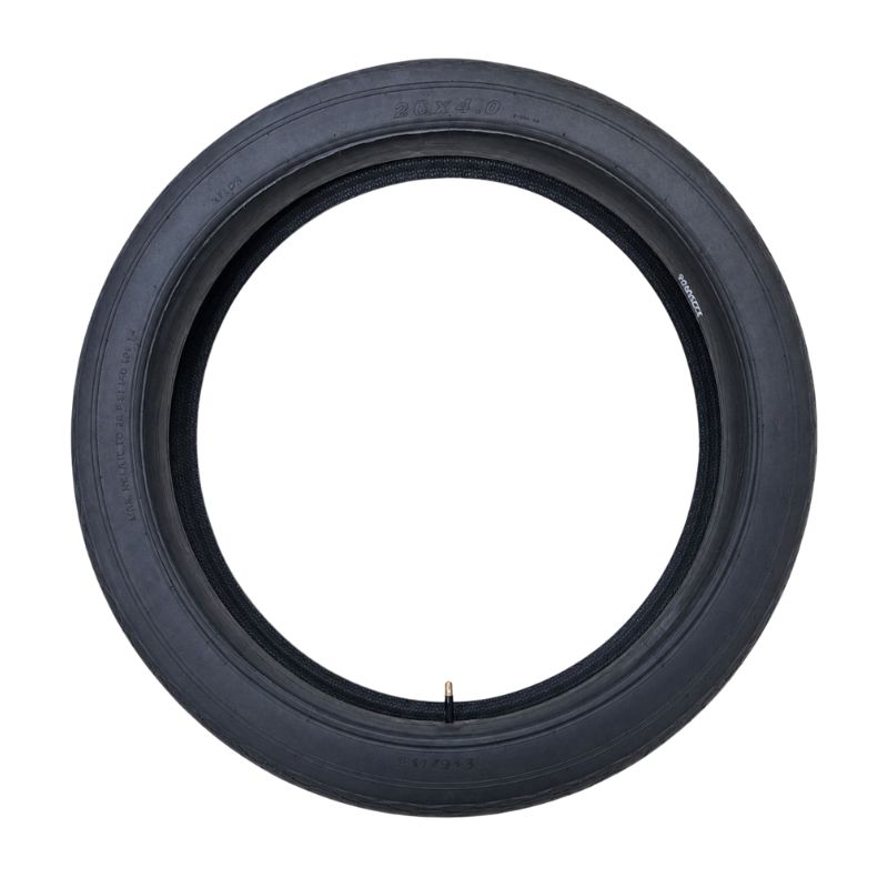 Black tire laid flat with inner tube visible around the rim edge, photographed for product display